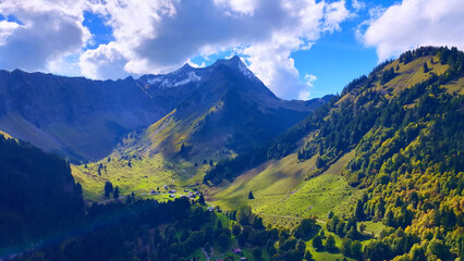4K Drone View Alpine Valley With Chalets And Mountain Peaks © Drones Sauvages