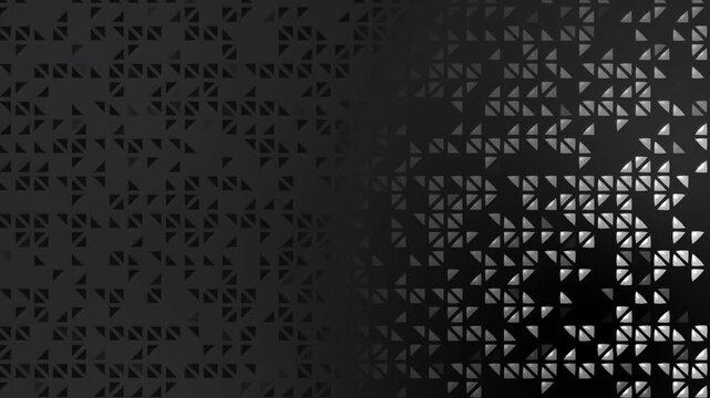 Monochrome abstract pattern with dark gray flat triangles and glossy 3D-effect white and silver triangles on the right. Copy space. Animated border. Looped.