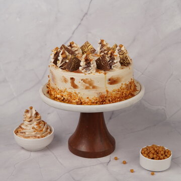 Delicious Butterscotch dessert with a rich creamy texture and classic caramel flavor. This sweet treat features smooth cream layers and crunchy butterscotch bits, creating a perfect balance of sweetne