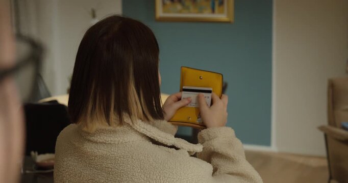 Close-up scene of a man secretly trying to take a woman&rsquo;s credit card and wallet, highlighting fraud, identity theft, and financial crime risks in everyday situations.