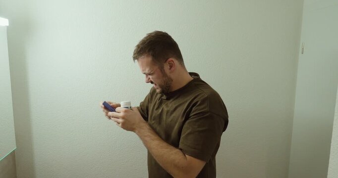 Man experiencing skin irritation and discomfort while checking medication packaging, illustrating possible side effects, allergy symptoms, and adverse drug reactions.
