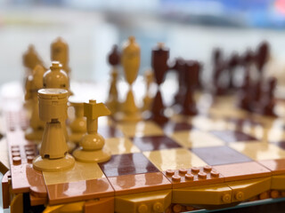 Naklejka premium Lego-style chessboard close-up