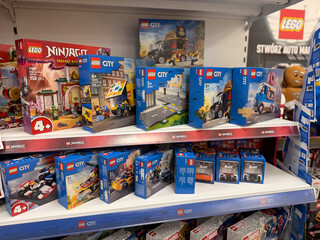 Naklejka premium Lego city and ninjago sets on store shelf
