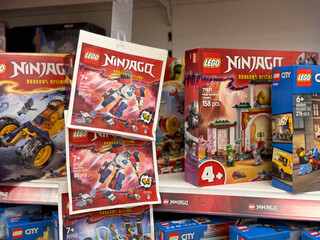 Naklejka premium Lego ninjago and city sets on retail shelf