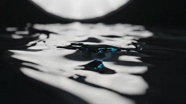 Liquid metal waves flowing in a futuristic abstract landscape with metallic fluid motion captured from a close-up viewpoint