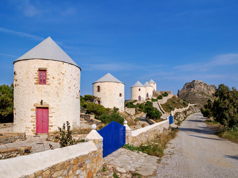 Windmills of Pandeli with Medieval Castle in the background, Leros Island, Dodecanese, Greece