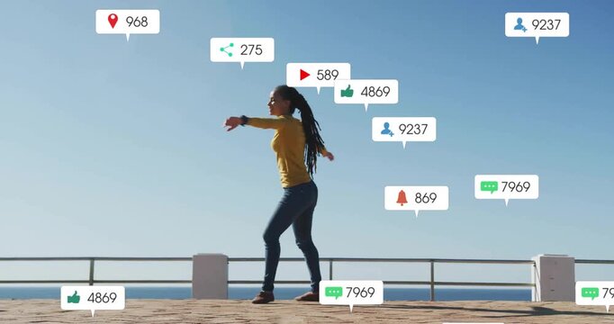 Content creator dancing on promenade railing, notifications multiplying, driving social metrics