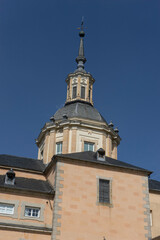 Obraz premium Tower of a historic building against a clear sky.. Royal Palace of La Granja de San Ildefonso, Spain