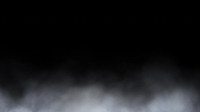 White fog rolling low to the ground against a black background. Seamless looped.