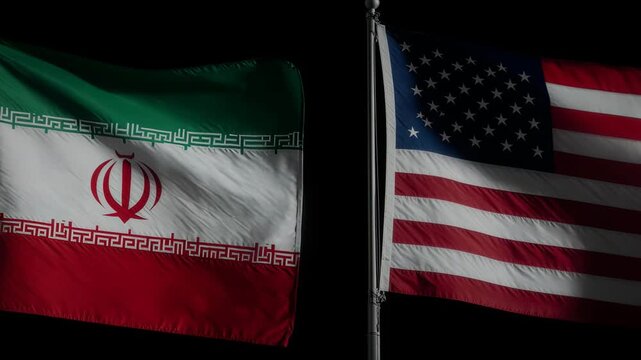 Iran and United States national flags side by side against dark background.