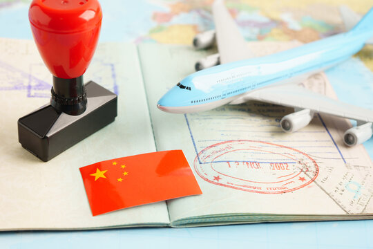 China passport with approved stamp on document for tourism.