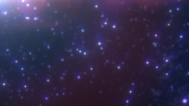 Soft blue and purple glowing light particles floating in the dar