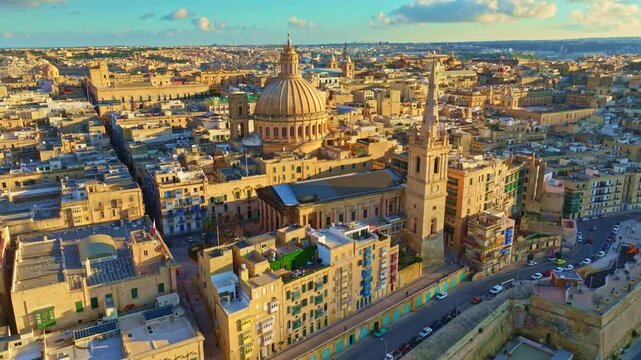 Drone sunset view of Valletta city, capital of Maltese island. Sunset, main church, evening