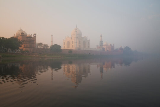 Taj Mahal at sunrise reflected in Yamuna River, Agra, Uttar Pradesh, India