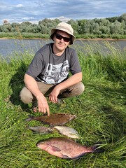 The fisherman caught a fish in the river.