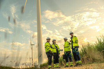 Renewable energy engineers discussing sustainable onshore wind power generation. Environmental team...