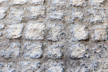 Obraz premium Rough historic stone wall texture with irregular masonry pattern typical for traditional Portuguese architecture, Portugal, Serra da Estrela, 16 October 2025