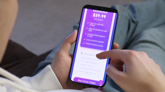 Planning a weekend show. A user explores circus performance details on a phone and prepares to buy tickets. Versatile footage for event management, mobile technology trends, and consumer behavior