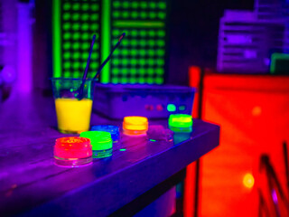 Bright neon photo with vibrant glowing paint and UV effect © Lisette
