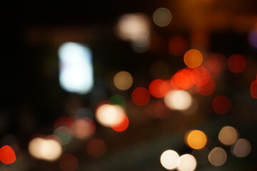 Obraz premium Colorful bokeh background. Bokeh of city street lights at night.