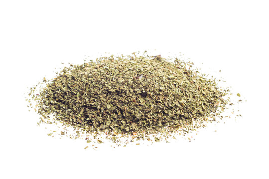 Oregano dried leaves pile, isolated on white background.