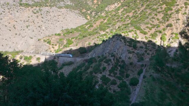 4K Gimbal Shot of Train Passing Through the Valley Near Caminito del Rey, Andalusia, Spain &mdash; Scenic Mountain Railway Landscape
