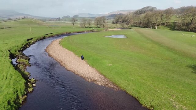 Aerial view over the River Ure in Hawes from a drone 4K video