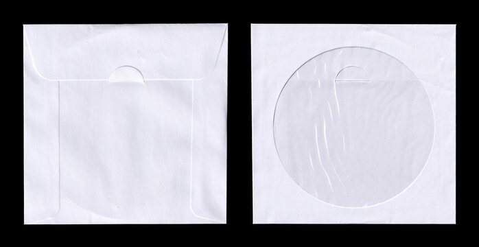 Blank White Paper CD Sleeves Mockup on Black Background. Two blank white paper CD/DVD sleeves on a black background, one with flap and one with circular window. Photo
