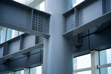Naklejka premium Close-up of steel structural beam and column connection nodes with rivets and bolts