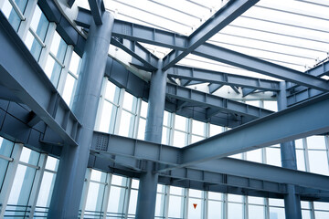 Fototapeta na wymiar Interior view of modern steel structure building with exposed beams and columns