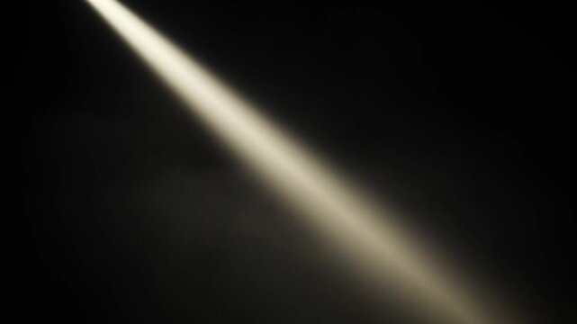 Dramatic spotlight beam illuminating darkness artistic light and shadow concept