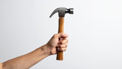 Close up photo of a hand holding a hammer on a plain white background
