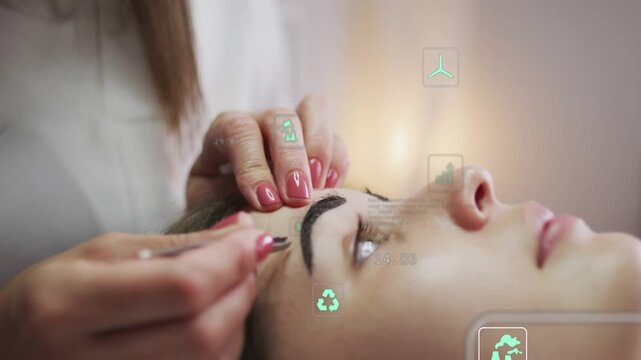 Beautician positioning tool, steadying client forehead, shaping eyebrow while HUD spa icons guiding