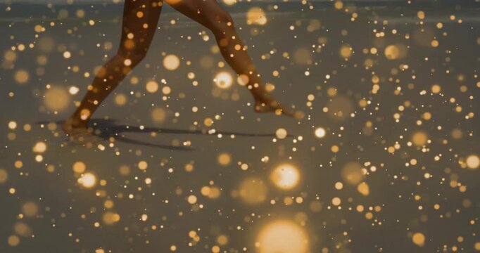 Woman training fitness on shore board, placing foot, shifting, golden particles drifting over legs