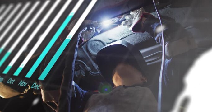 Tech working under car using lamp and activating motion overlay showing part hiding view for repair