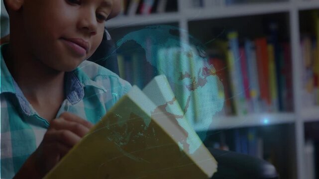 Boy turning yellow book causing dotted globe over pages and face linking reading to online learning