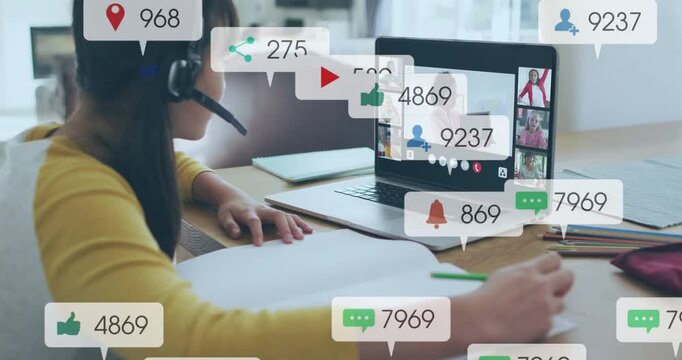 Kid writing table while incoming heart bell icons growing over laptop, interrupting online class