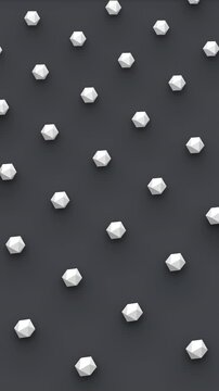 Futuristic 3d render of polyhedral shapes seamless moving in isometric view on dark background. Computer generated loop animation. 4K seamless vertical motion design