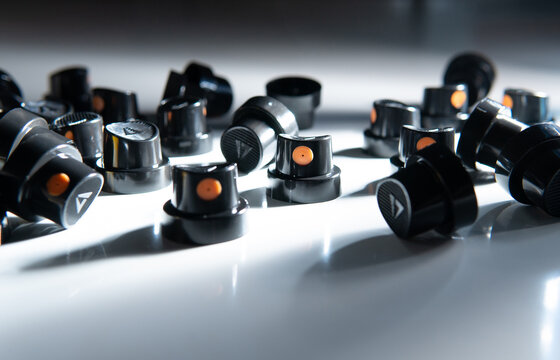 Black spray can caps with dramatic shadows, graffiti background texture