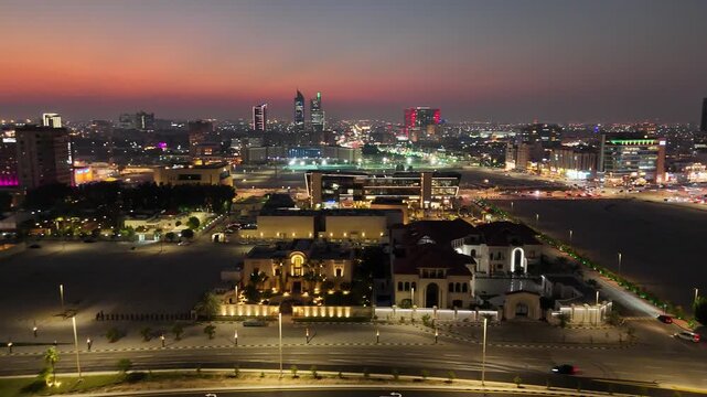 Drone shot view of city traffic at sunset golden hour