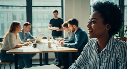 Obraz premium A diverse group of young professionals engaged in a meeting at a modern office table by the window.