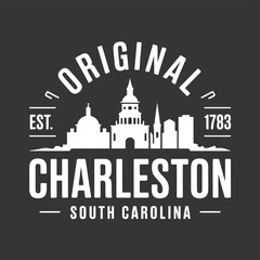 Fototapeta premium Vintage style emblem featuring the charleston skyline and established date