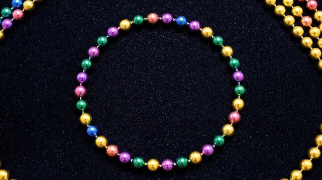 Hands Creating Multicolored Beaded Circle Jewelry.