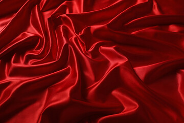 Obraz premium Stylish red silk fabric as background, closeup