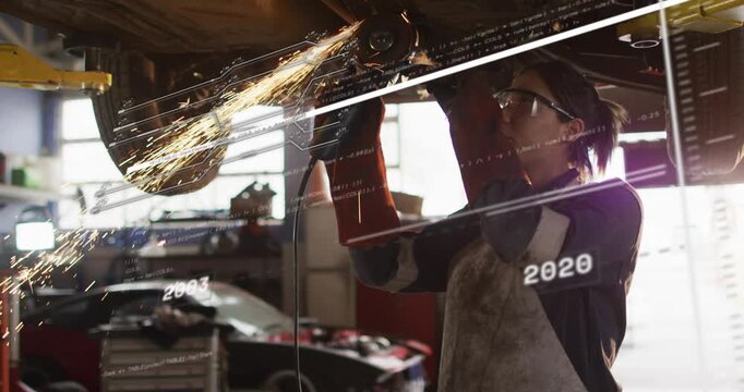 Woman tech starting grinder on lift grinding metal to fix while sparks arcing with years overlaying