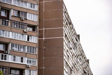 Old apartment block facades and windows creating an urban living pattern © Довидович Михаил