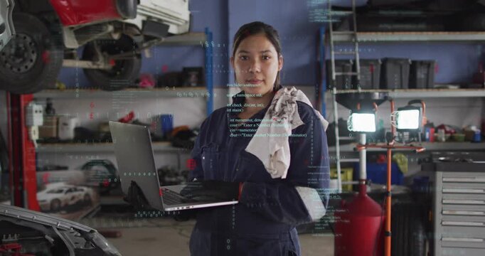 Female mechanic holding laptop after starting scan, code overlays flagging engine issues and status