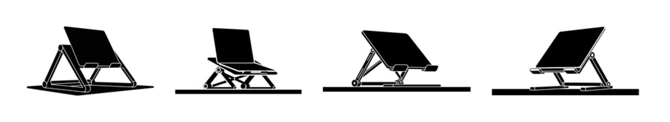 Set of four black adjustable tablet or e-reader stands in varying angled positions on white background © ARIF