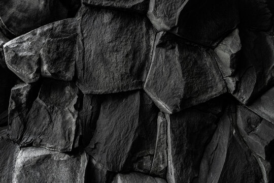 Detailed view of black volcanic basalt rock formations