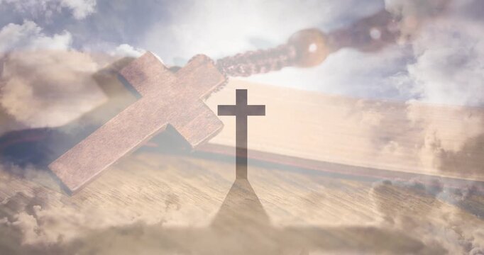 Sun rising behind mid cross starting clouds moving pendant beads fading outline crisping into halo
